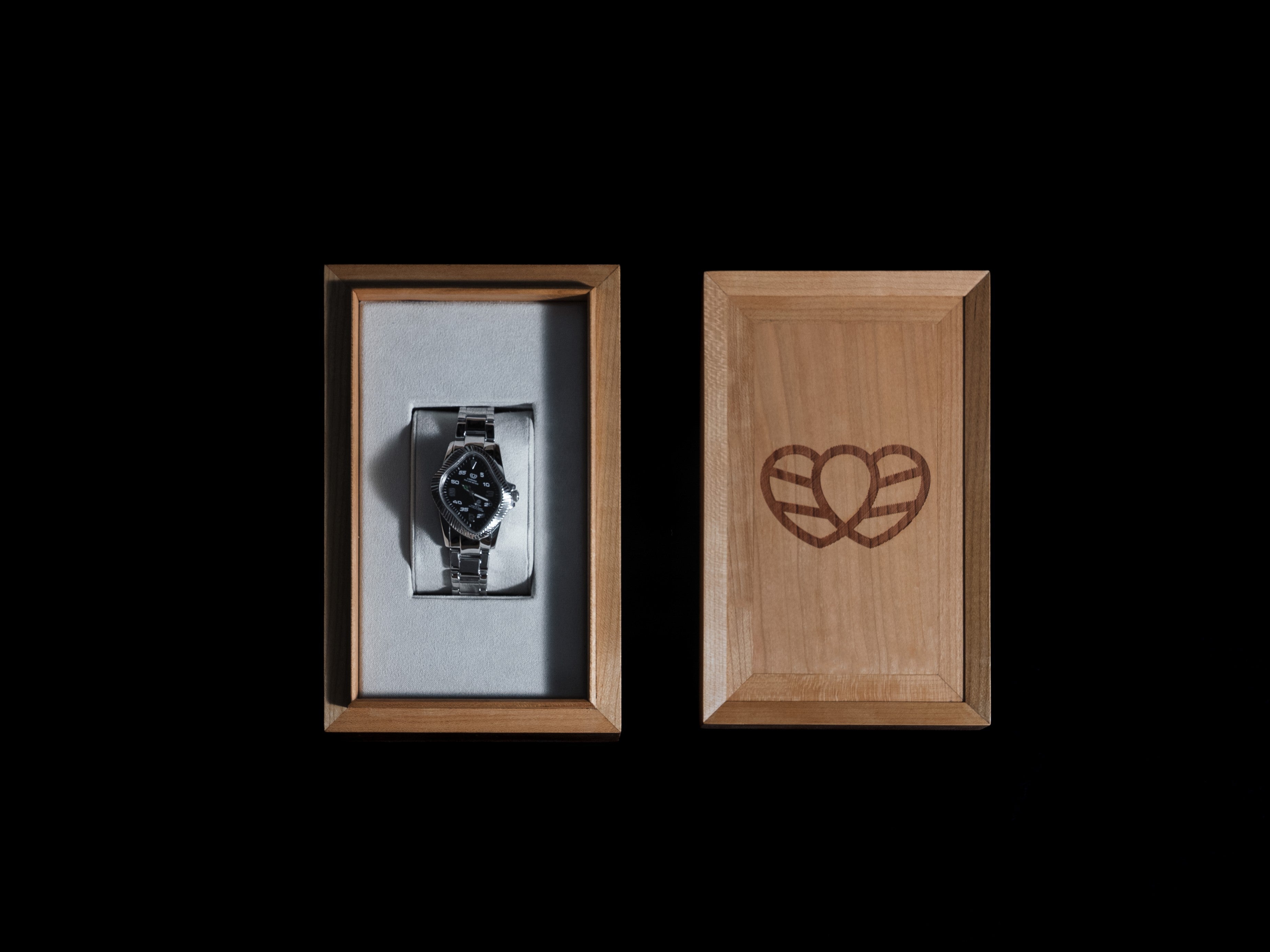 Detail of wooden box engraving featuring Laarvee logo for premium designer watches